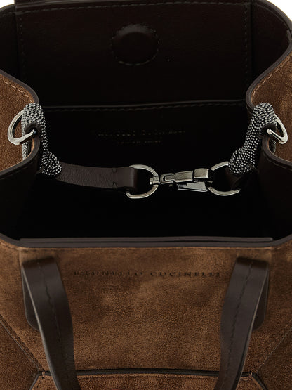 Mini Flap Handbag by Brunello Cucinelli for women in suede calfskin leather bicolour, brown, green & signature presents a ornamental silhouette, showcasing a secure snap, flap, magnetic & hook, ample , and versatile shoulder-strap, handle, adjustable-strap & detachable-strap for a ornamental finish.