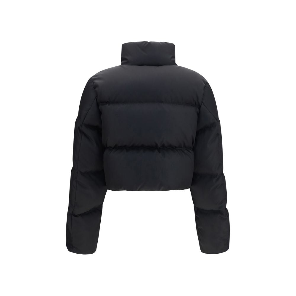Puffer Jacket by Prada for women in nylon & goose-down black & signature features a dramatic silhouette, showcasing a sophisticated and distinctive pockets & insulated for a dramatic aesthetic.