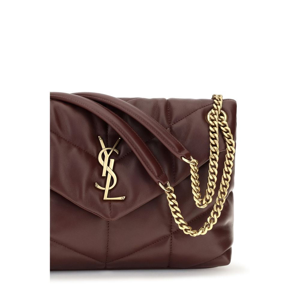 Mini Crossbody Flap Shoulder Bag by Saint Laurent for women in calf & lambskin leather bicolour, gold, green & signature features an effortlessly chic silhouette with a secure snap, flap, magnetic & button, ample single-compartment, and versatile crossbody-strap, shoulder-strap, handle & adjustable-strap for effortlessly chic everyday luxury.