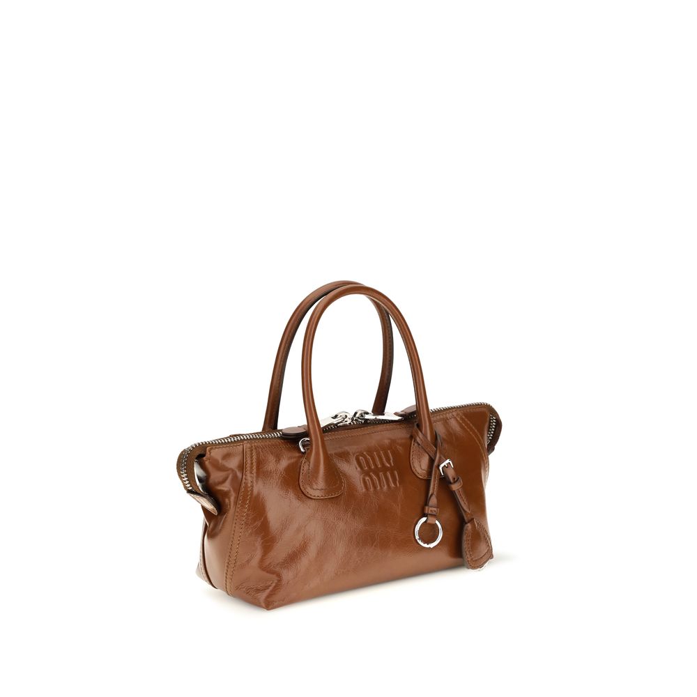 Mini Flap Handbag by Miu Miu for women in bos taurus calfskin leather bicolour, brown & green features a refined silhouette, showcasing a secure snap, flap & zipper, organized , and versatile shoulder-strap, handle, adjustable-strap & detachable-strap for a refined finish.