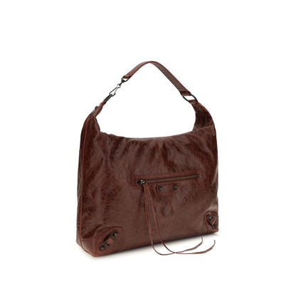Crossbody Flap Shoulder Bag by Balenciaga for women in calf & lambskin leather bicolour & green presents a versatile silhouette, showcasing a secure snap, flap & zipper and versatile with versatile crossbody-strap, shoulder-strap, handle & adjustable-strap for a sophisticated look.