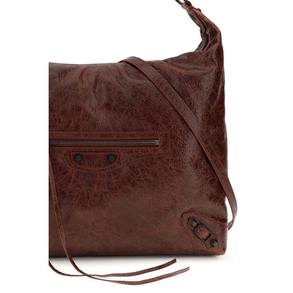 Crossbody Flap Shoulder Bag by Balenciaga for women in calf & lambskin leather bicolour & green features a distinguished silhouette, showcasing a secure snap, flap & zipper and distinguished with versatile crossbody-strap, shoulder-strap, handle & adjustable-strap for a distinguished finish.