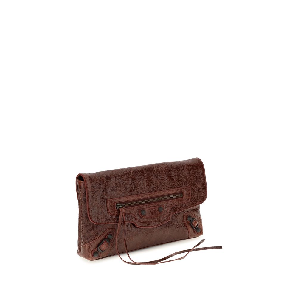 Mini Drawstring Clutch Handbag by Balenciaga for women in calf & lambskin leather bicolour, green & signature showcases a sculptural silhouette, featuring a secure snap, flap, zipper & magnetic, ample , and versatile shoulder-strap, handle & adjustable-strap for a sculptural aesthetic.