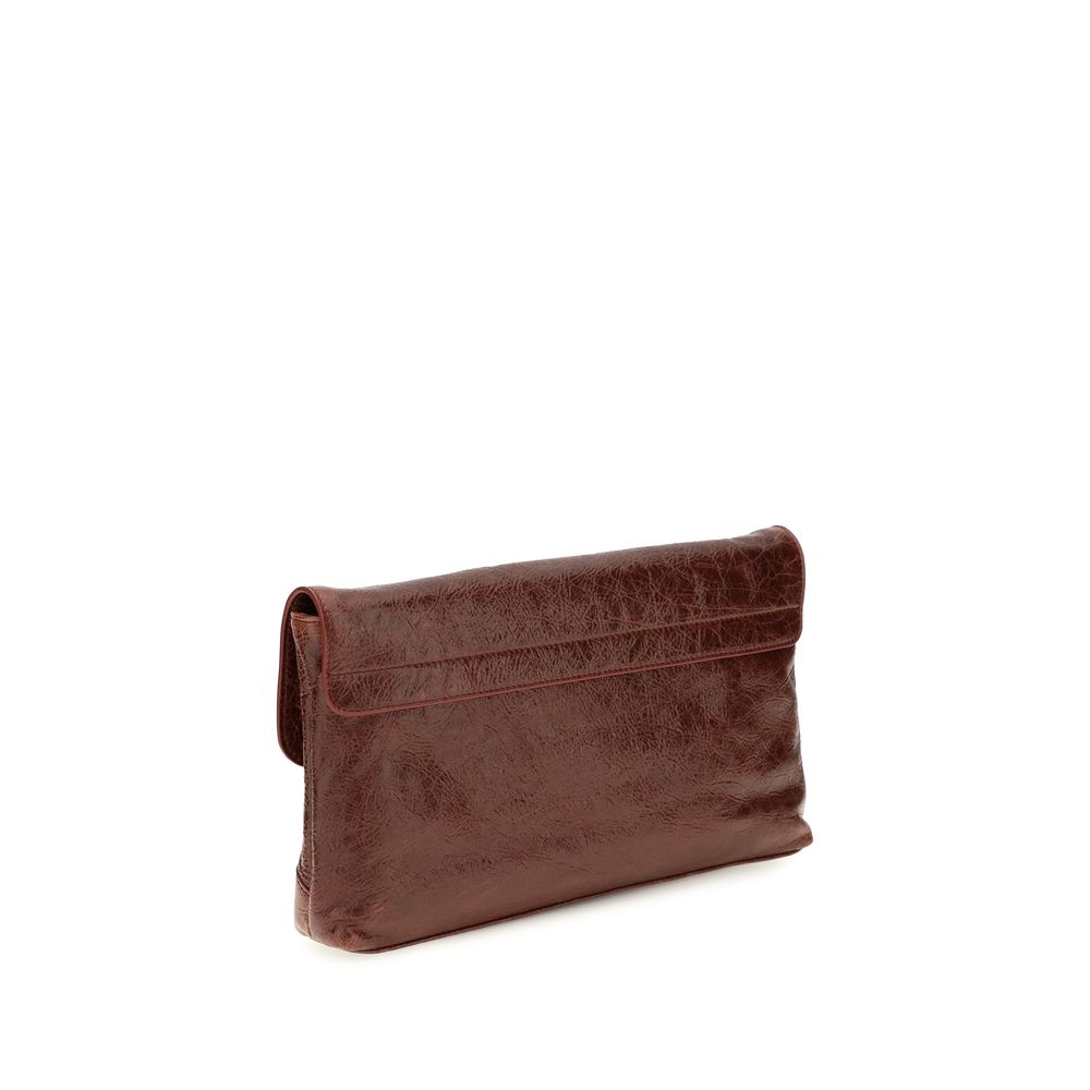 Mini Drawstring Clutch Handbag by Balenciaga for women in calf & lambskin leather bicolour, green & signature showcases a sculptural silhouette, featuring a secure snap, flap, zipper & magnetic, ample , and versatile shoulder-strap, handle & adjustable-strap for a sculptural finish.