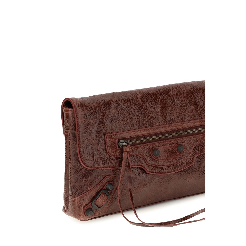 Mini Drawstring Clutch Handbag by Balenciaga for women in calf & lambskin leather bicolour, green & signature features a statuesque silhouette, showcasing a secure snap, flap, zipper & magnetic and organized with versatile shoulder-strap, handle & adjustable-strap for statuesque evening wear.