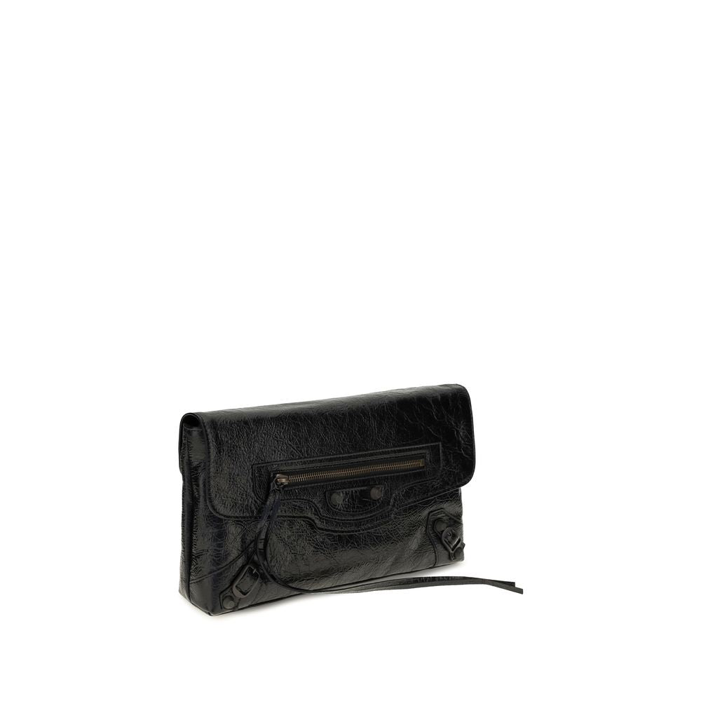 Mini Drawstring Clutch Handbag by Balenciaga for women in calf & lambskin leather bicolour, black & green features a sculptural silhouette with a secure snap, flap, zipper & magnetic, organized , and versatile shoulder-strap, adjustable-strap & handle for a sculptural finish.