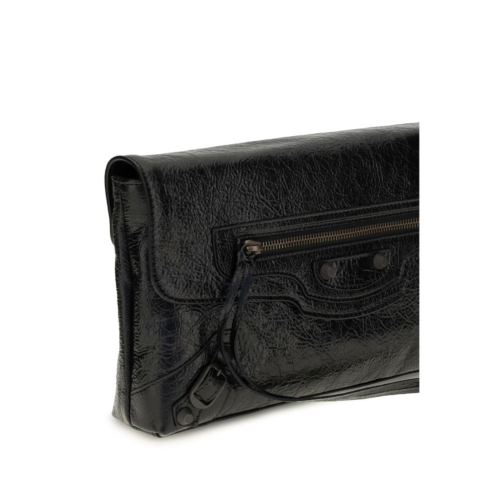 Mini Drawstring Clutch Handbag by Balenciaga for women in calf & lambskin leather bicolour, black & green features a architectural silhouette, showcasing a secure snap, flap, zipper & magnetic, ample , and versatile shoulder-strap, adjustable-strap & handle for a architectural finish.
