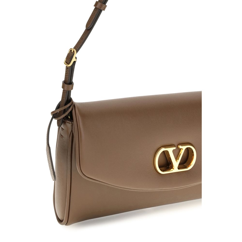 Mini Shoulder Flap Bag by Valentino Garavani for women in bos taurus calfskin nappa leather bicolour, brown, green & signature features a distinguished silhouette, showcasing a secure snap, flap & magnetic and distinguished single-compartment with versatile shoulder-strap, adjustable-strap & handle for a distinguished finish.