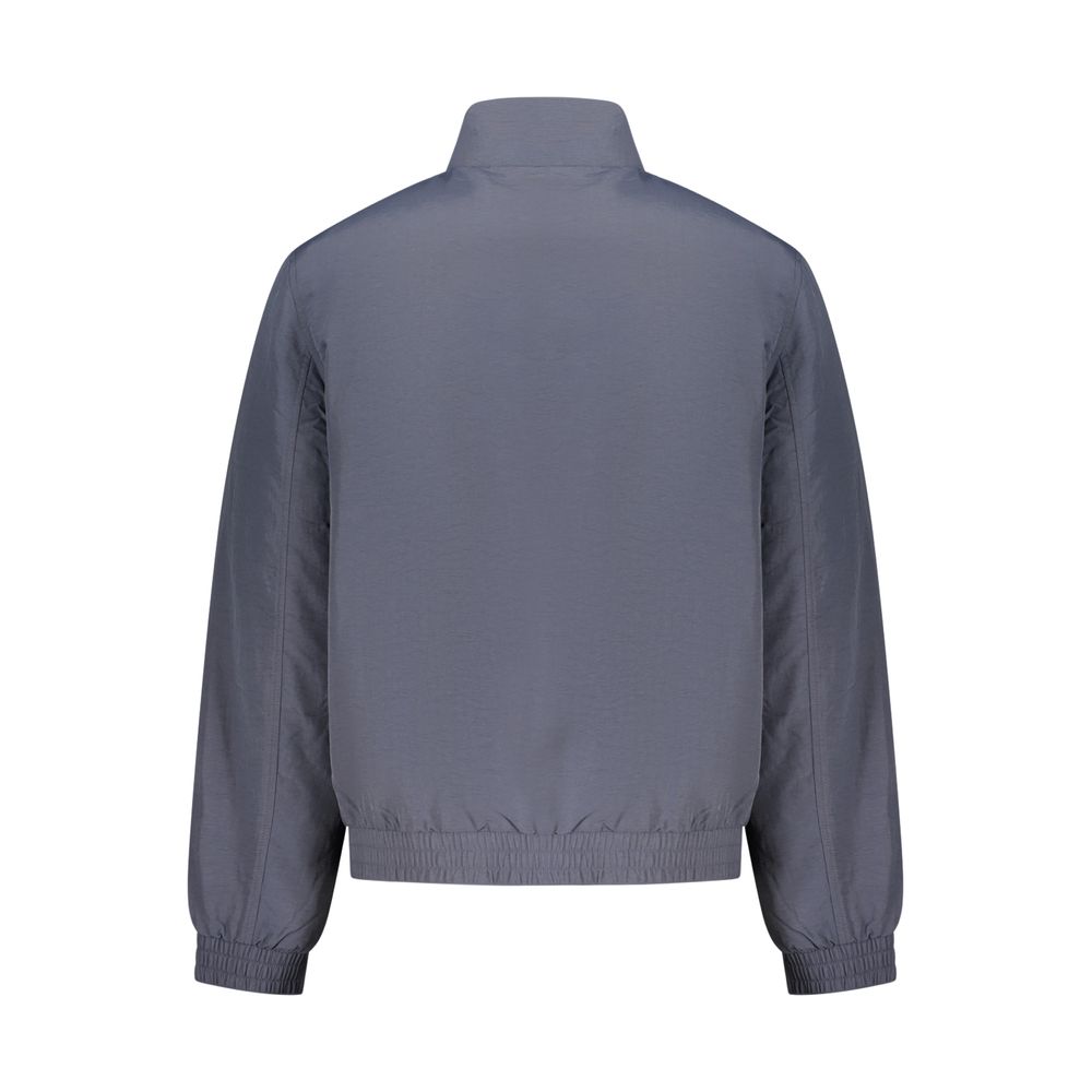 Overcoat by Calvin Klein for men in plastic polyamide blue & signature features a cosy chic silhouette, artfully detailed with a sophisticated and premium pockets for a cosy chic finish.