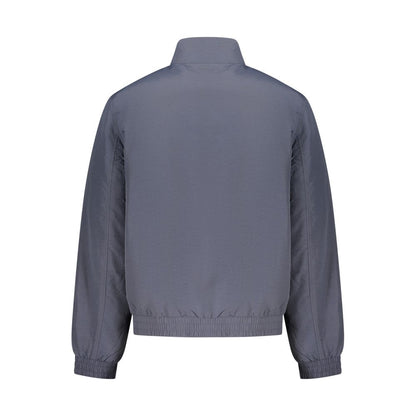 Overcoat by Calvin Klein for men in plastic polyamide blue & signature features a cosy chic silhouette, artfully detailed with a sophisticated and premium pockets for a cosy chic finish.
