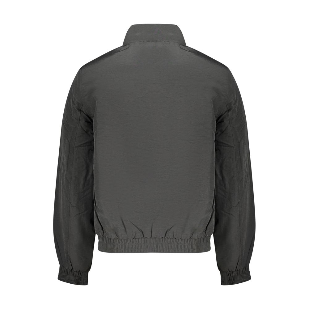 Overcoat by Calvin Klein for men in plastic polyamide black & green features an voluminous silhouette, showcasing distinct pockets and a voluminous for a truly voluminous aesthetic.