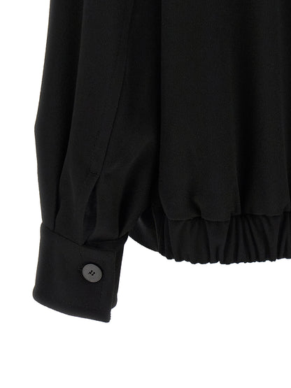 This Bomber Jacket by Alberto Biani for women in wool black exhibits a edgy silhouette, meticulously detailed with functional pockets and a edgy for a edgy finish.