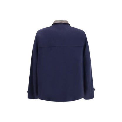 Overcoat by Brunello Cucinelli for men in virgin wool & leather blue features an voluminous silhouette, showcasing distinct pockets and a voluminous shirt-collar neckline for a truly voluminous aesthetic.