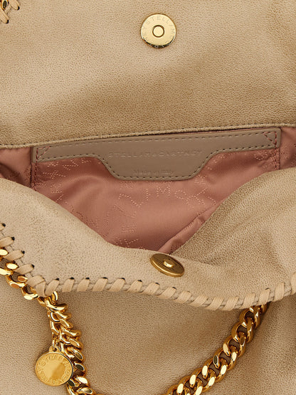 Mini Shoulder Bag by Stella McCartney for women in polyester leather beige & signature features an effortlessly chic silhouette with a secure , ample , and versatile shoulder-strap & handle for effortlessly chic everyday luxury.