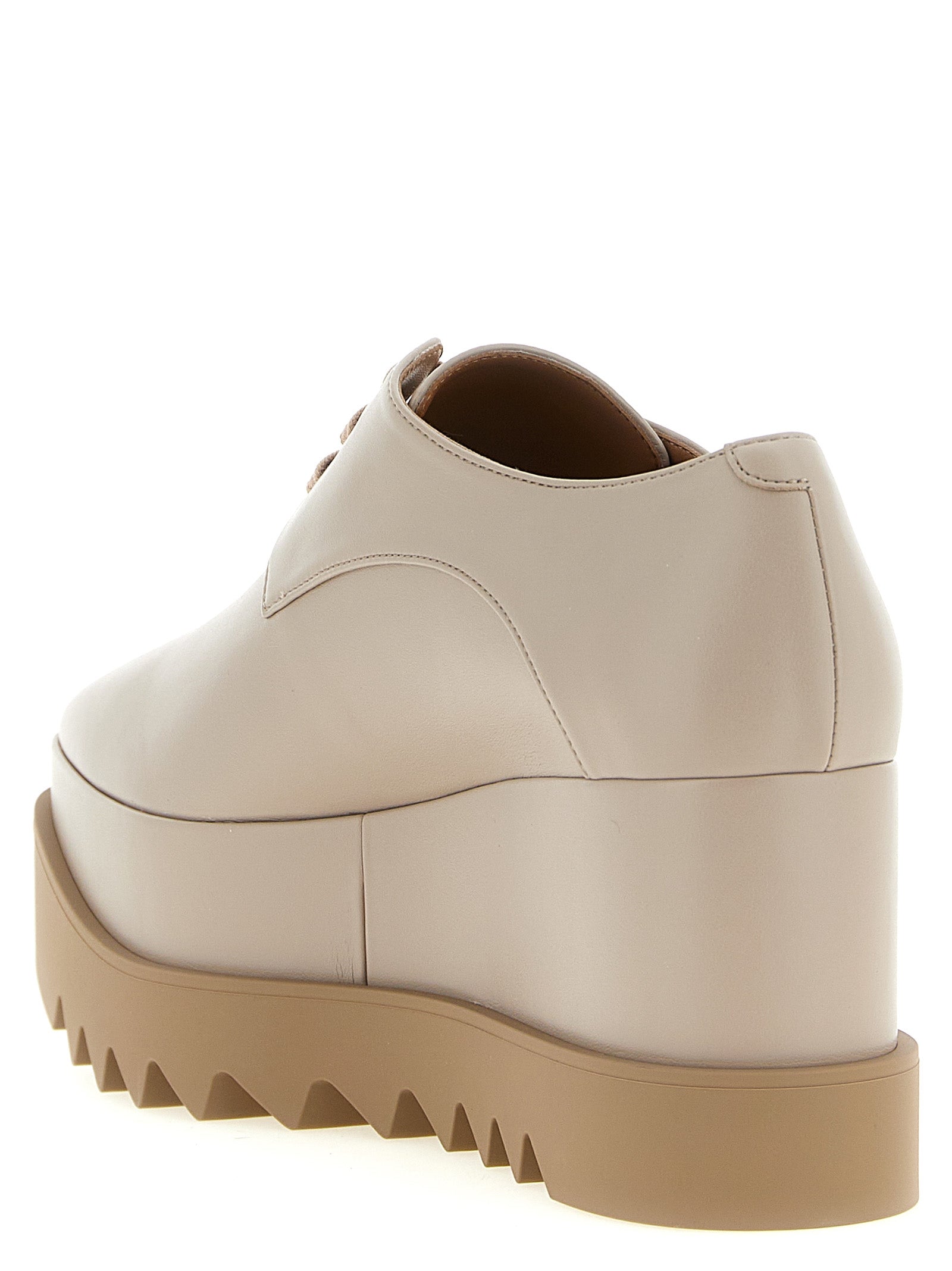 Flat Shoes by Stella McCartney for women in eva beige presents a effortless chic silhouette, showcasing the Women's EVA Flat Shoes design with a effortless chic and square toe style for a sophisticated look.