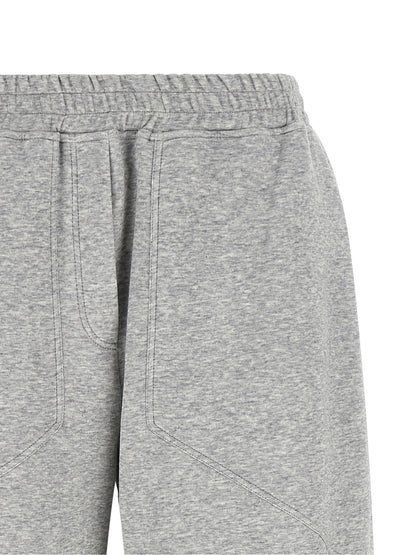 Joggers by Brunello Cucinelli for women in polyamide cotton & cashmere gray presents a tailored silhouette, showcasing a tailored athletic & wide and long cut with a refined for a truly tailored aesthetic.
