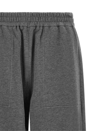 Joggers by Brunello Cucinelli for women in cotton dark-gray & natural features an sophisticated and wide with a precise long, creating a sophisticated and sophisticated silhouette.
