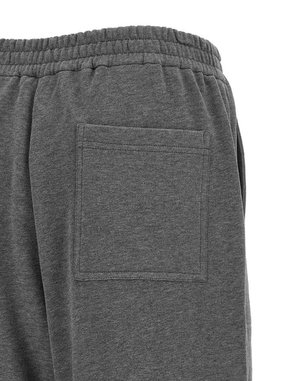 Joggers by Brunello Cucinelli for women in cotton dark-gray & natural features a refined silhouette with a refined wide, defined by a and a refined long for a refined finish.