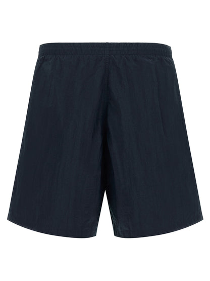Swim Shorts by Fendi for men in polyamide dark-blue & multicolor features a beach chic silhouette, showcasing the signature style of the Selleria Men's Polyamide Swim Shorts.
