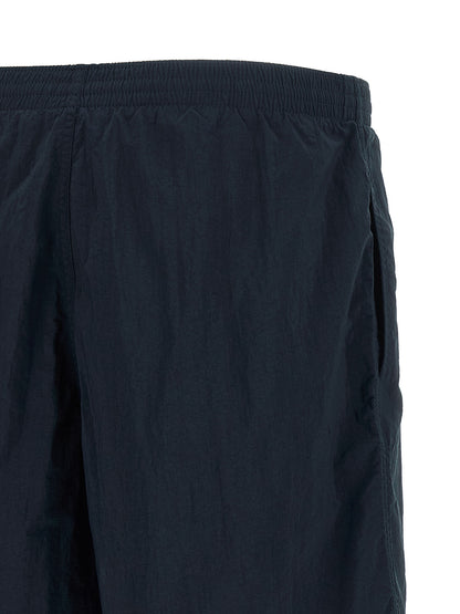 Swim Shorts by Fendi for men in polyamide dark-blue & multicolor features a riviera-ready silhouette, showcasing the Selleria Men's Polyamide Swim Shorts design for a premium look.