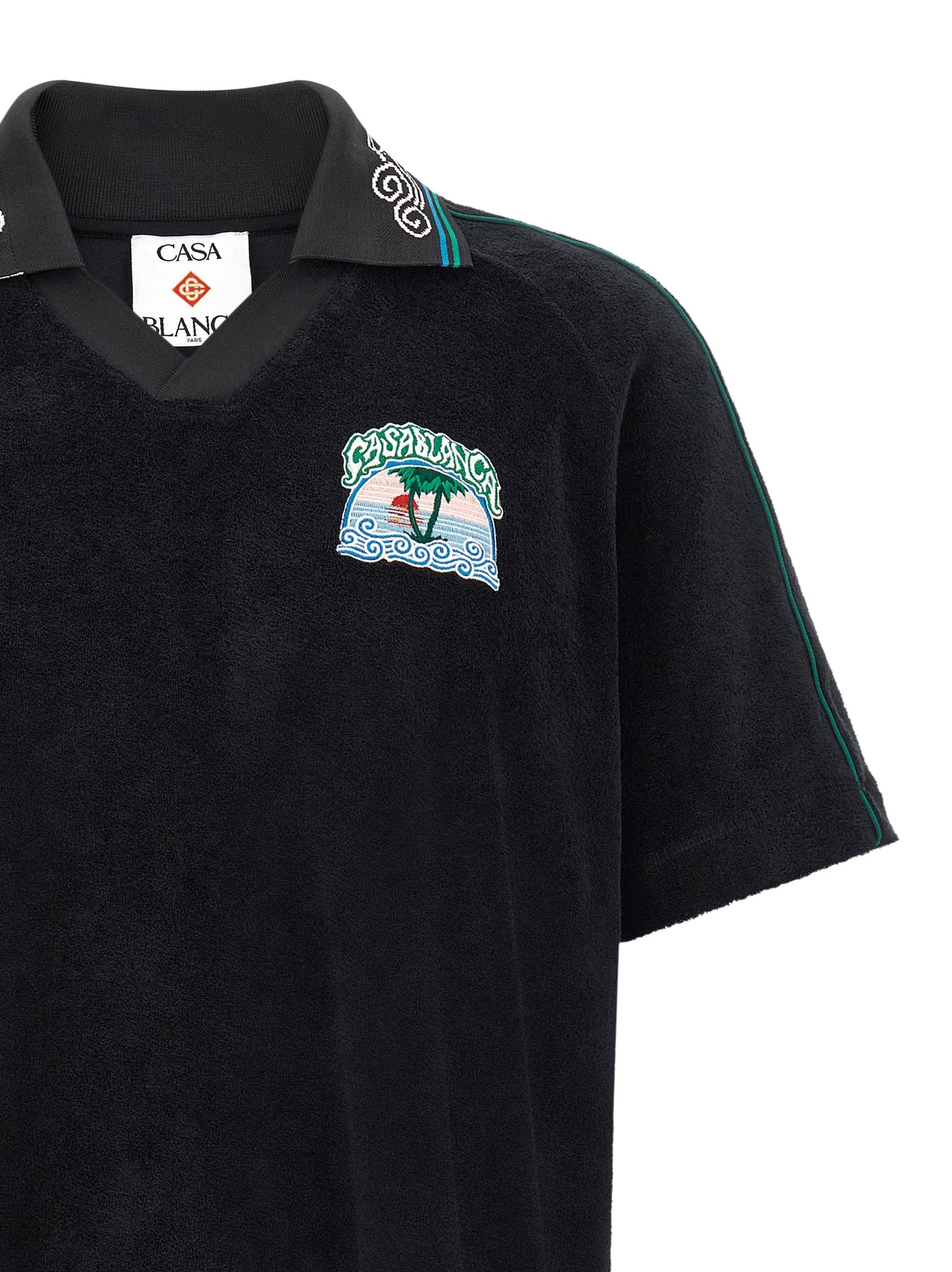This Polo Shirt by Casablanca for men in cotton terry cloth black, green & white presents a flawless silhouette, showcasing flawless detailing and a refined v-neck neckline for a truly flawless aesthetic.