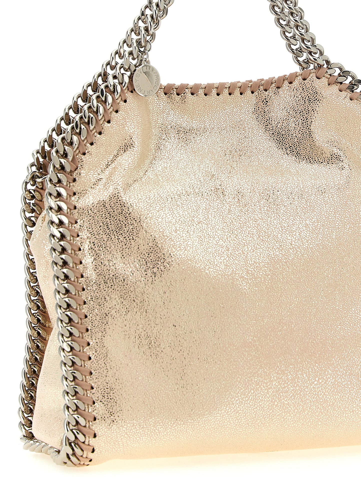 Mini Crossbody Tote Handbag by Stella McCartney for women in palladium & polyester multicolor, palladium & pink features an multi-faceted design with a secure magnetic, ample , and versatile crossbody-strap, shoulder-strap & handle for a multi-faceted finish.