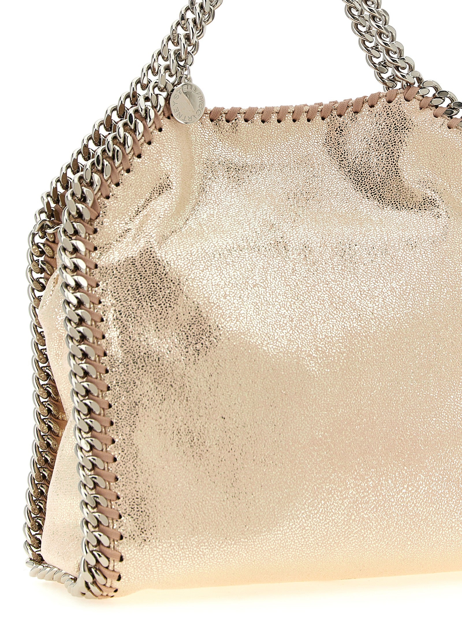Mini Crossbody Tote Handbag by Stella McCartney for women in palladium & polyester multicolor, palladium & pink features an multi-faceted design with a secure magnetic, ample , and versatile crossbody-strap, shoulder-strap & handle for a multi-faceted finish.