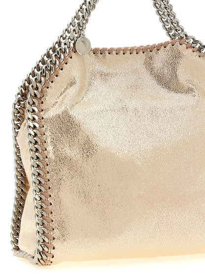 Mini Crossbody Tote Handbag by Stella McCartney for women in palladium & polyester multicolor, palladium & pink features an multi-faceted design with a secure magnetic, ample , and versatile crossbody-strap, shoulder-strap & handle for a multi-faceted finish.