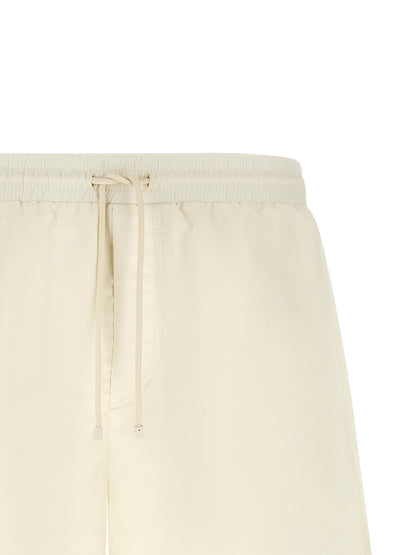 Swim Shorts by Brunello Cucinelli for men in polyester cream & white features a resort ready silhouette, capturing the beach-ready style of the Men's Polyester Swim Shorts collection.