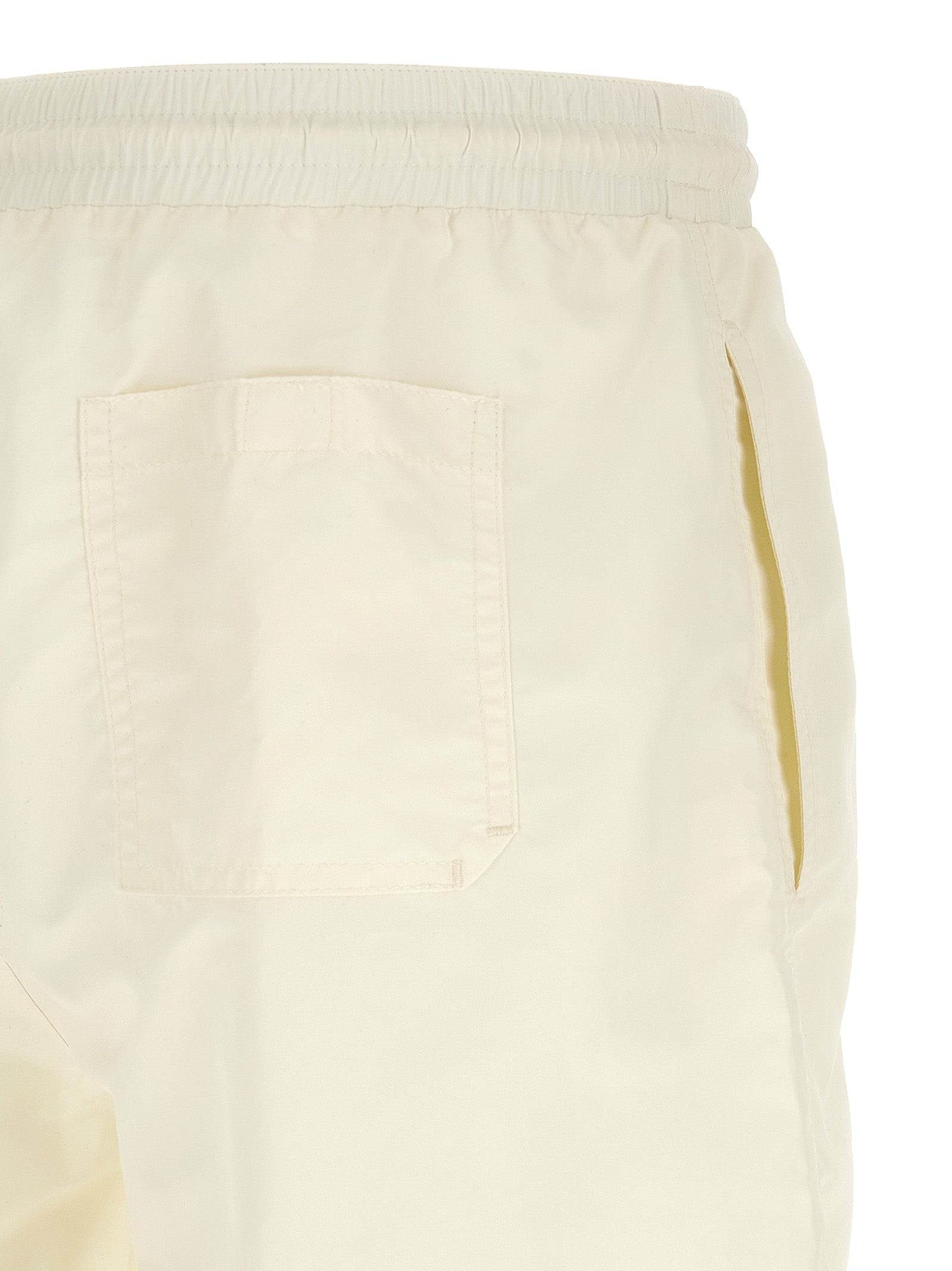 Swim Shorts by Brunello Cucinelli for men in polyester cream & white showcases a contemporary silhouette, artfully capturing the essence of the contemporary Men's Polyester Swim Shorts design for a sophisticated look.