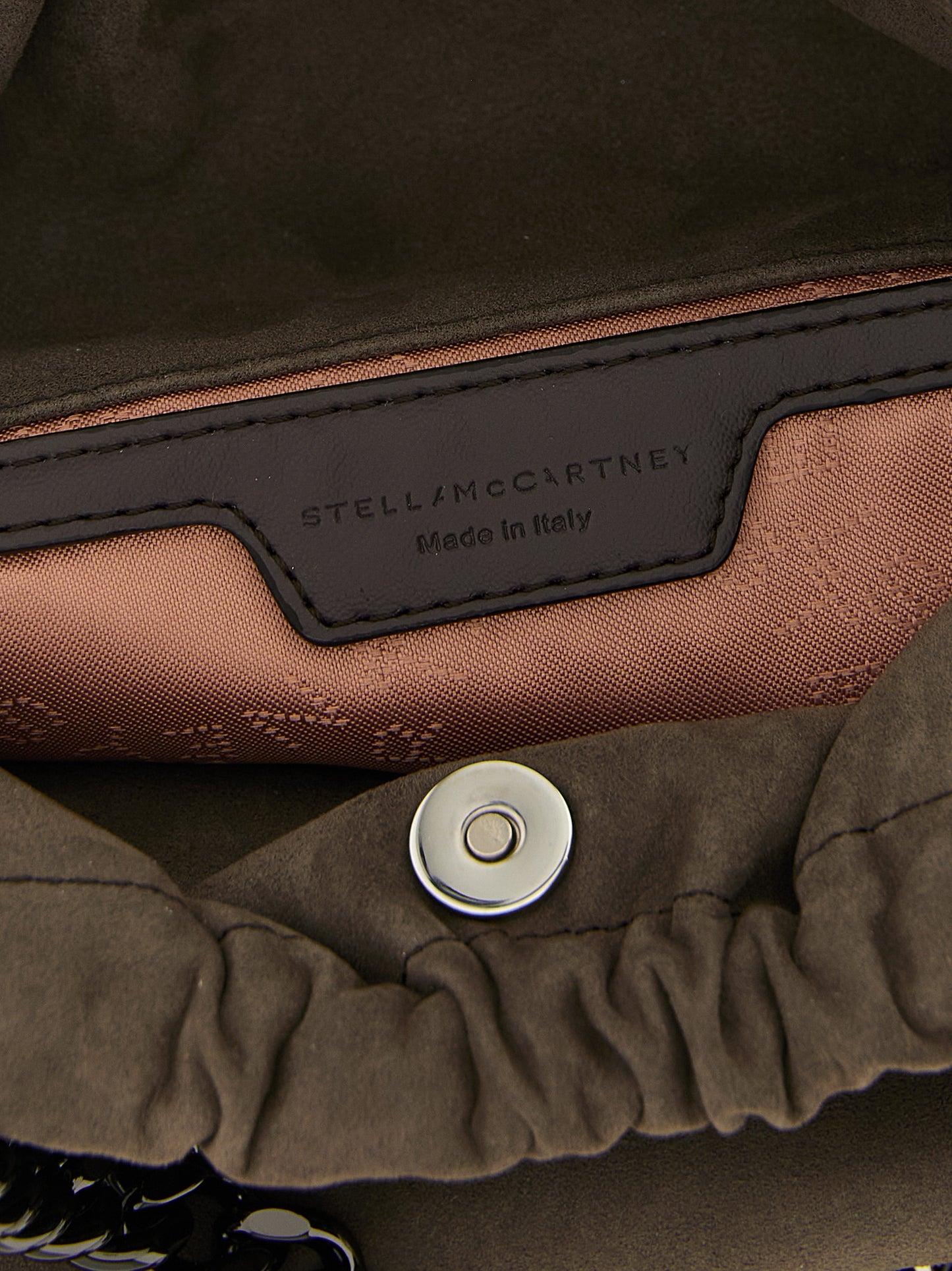 Mini Crossbody Drawstring Handbag by Stella McCartney for women in polyamide suede leather dark-ruthenium, gray, patterned & jacquard features an versatile silhouette, showcasing a secure drawstring & magnetic and versatile with versatile crossbody-strap & shoulder-strap for a versatile finish.