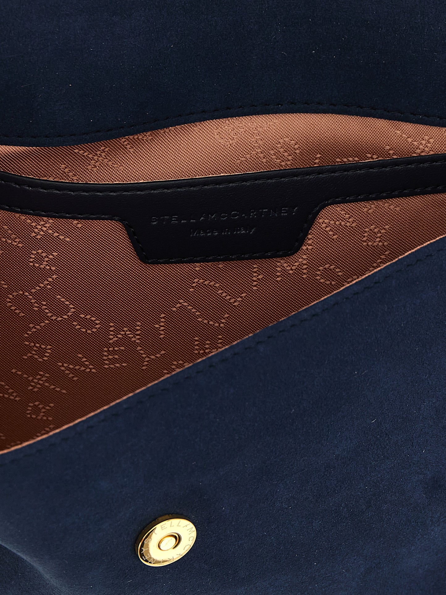 Mini Crossbody Flap Handbag by Stella McCartney for women in polyamide suede leather gold, navy & patterned features a versatile chic silhouette, meticulously detailed with a secure flap & magnetic, ample , and versatile crossbody-strap & shoulder-strap.