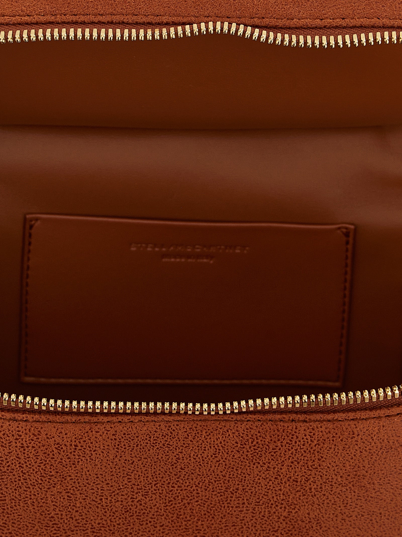 Small Crossbody Travel Tote Handbag by Stella McCartney for women in polyester suede leather gold & orange features an versatile silhouette, showcasing a secure zipper and versatile with versatile crossbody-strap, shoulder-strap & handle for a versatile finish.