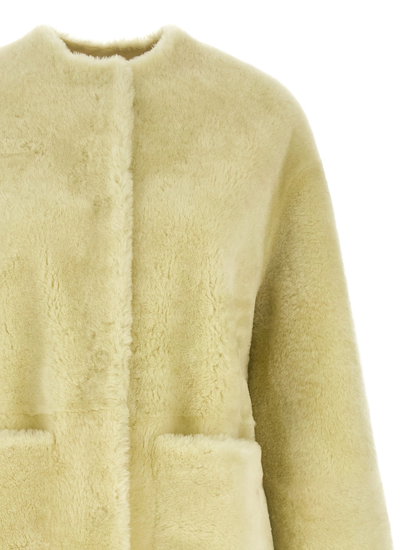 Overcoat by BLANCHA for women in lamb shearling bicolour & green showcases a enveloping silhouette, detailed with distinctive thermal & pockets and a enveloping round neckline.