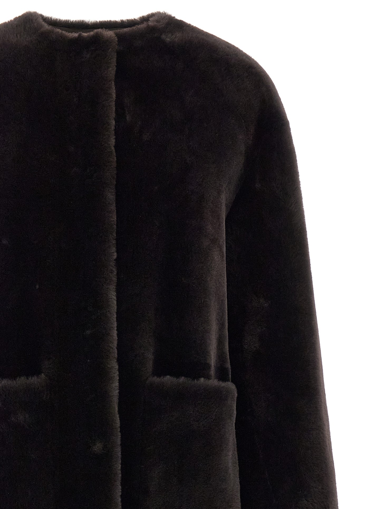 Overcoat by BLANCHA for women in lamb shearling brown showcases a architectural silhouette, artfully detailed with a distinctive round neckline and functional pockets for a architectural finish.