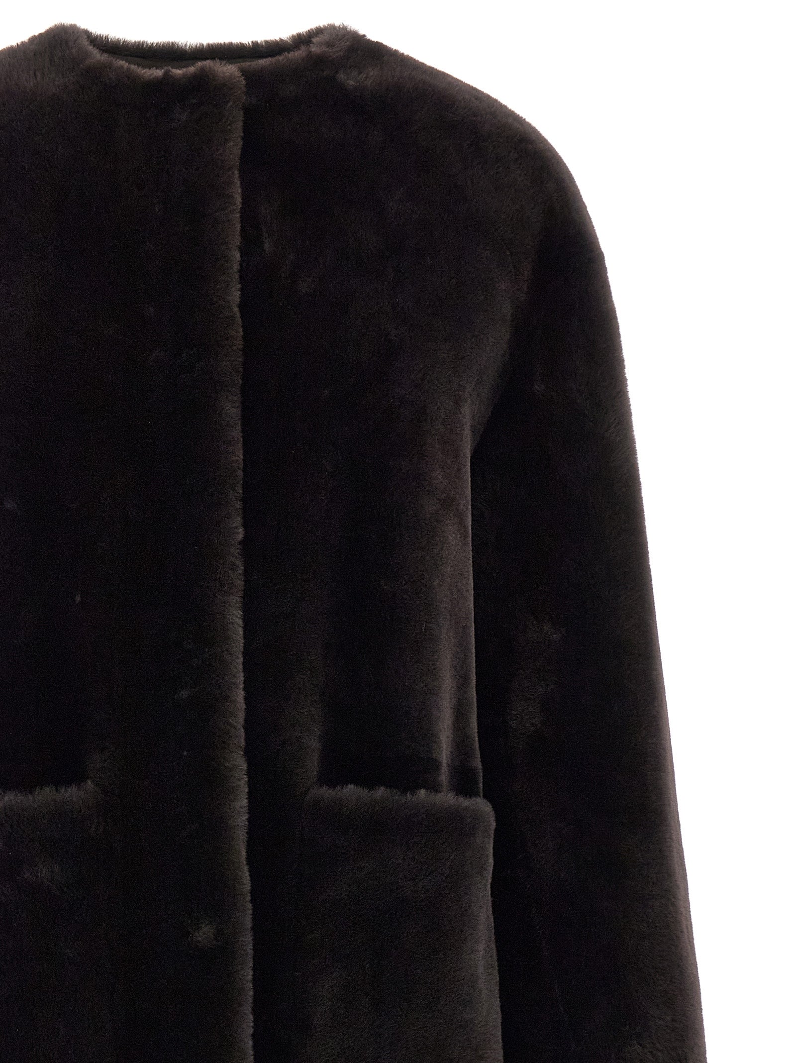 Overcoat by BLANCHA for women in lamb shearling brown showcases a architectural silhouette, artfully detailed with a distinctive round neckline and functional pockets for a architectural finish.