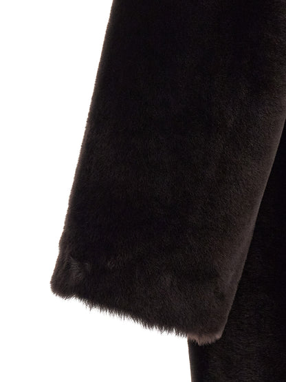 Overcoat by BLANCHA for women in lamb shearling brown features an satoral silhouette, showcasing a sophisticated and satoral pockets for a premium, timeless look.