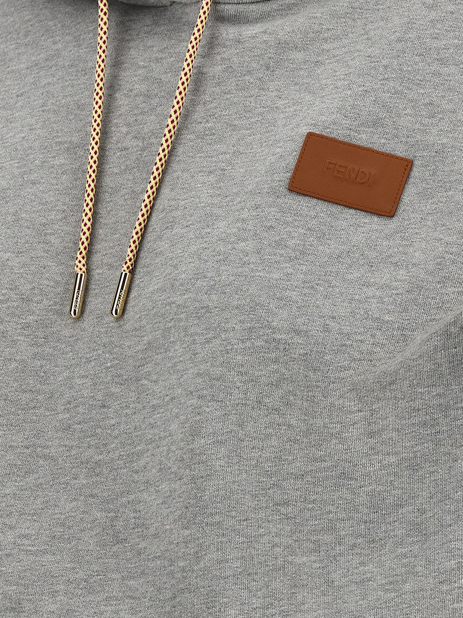 Sweatshirt Hoodie by Fendi for women in leather & cotton gray & gold features a slouchy chic silhouette, detailed with a slouchy chic and a signature for an elevated aesthetic.