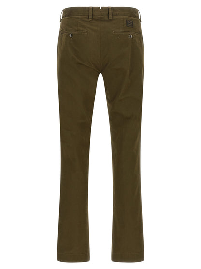 Trousers by Incotex for men in cotton canvas bicolour, green & olive features an sartorial silhouette, showcasing a precise straight-leg and long with a sartorial for a refined look.