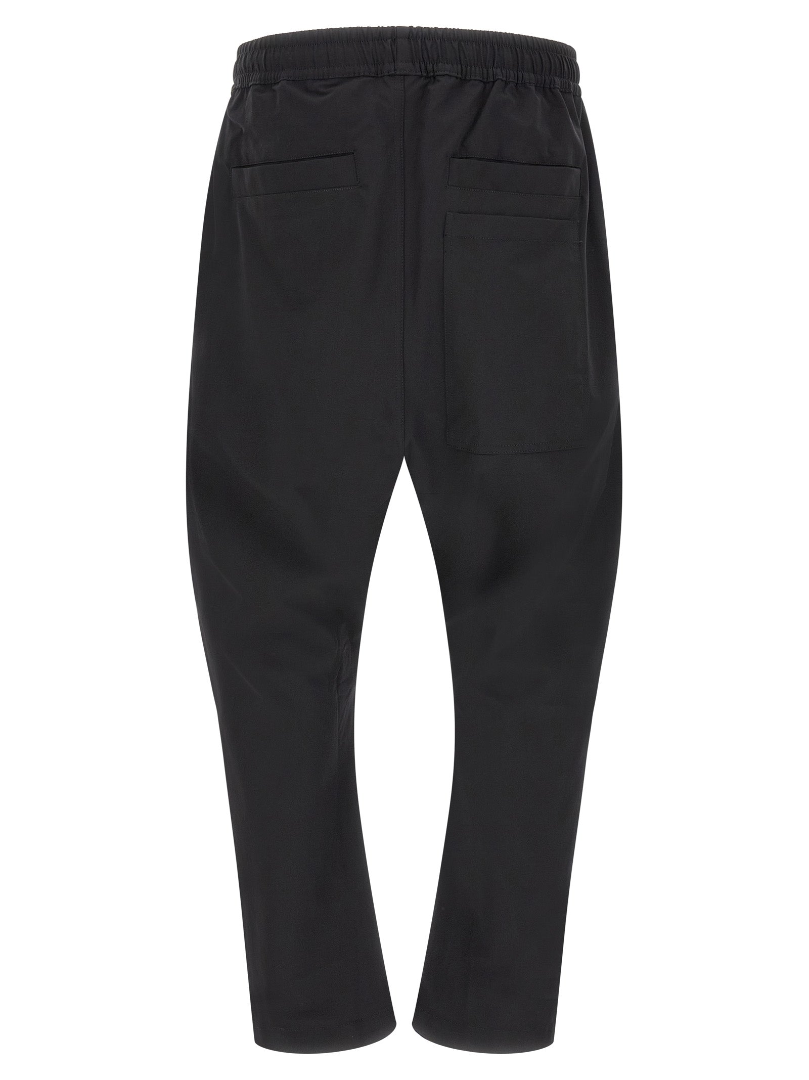 Trousers by Thom Krom for men in polyamide black features a tailored silhouette with a tailored athletic & relaxed-fit, defined by its long and a sophisticated .