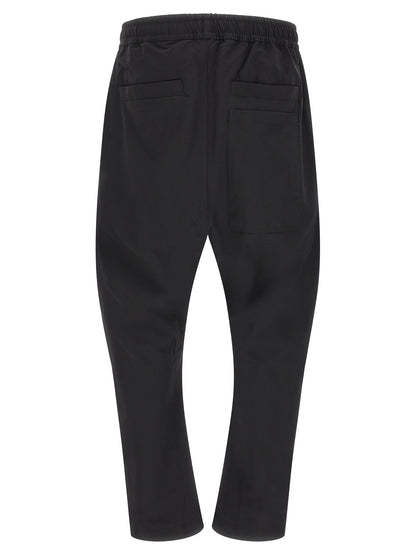 Trousers by Thom Krom for men in polyamide black features a tailored silhouette with a tailored athletic & relaxed-fit, defined by its long and a sophisticated .