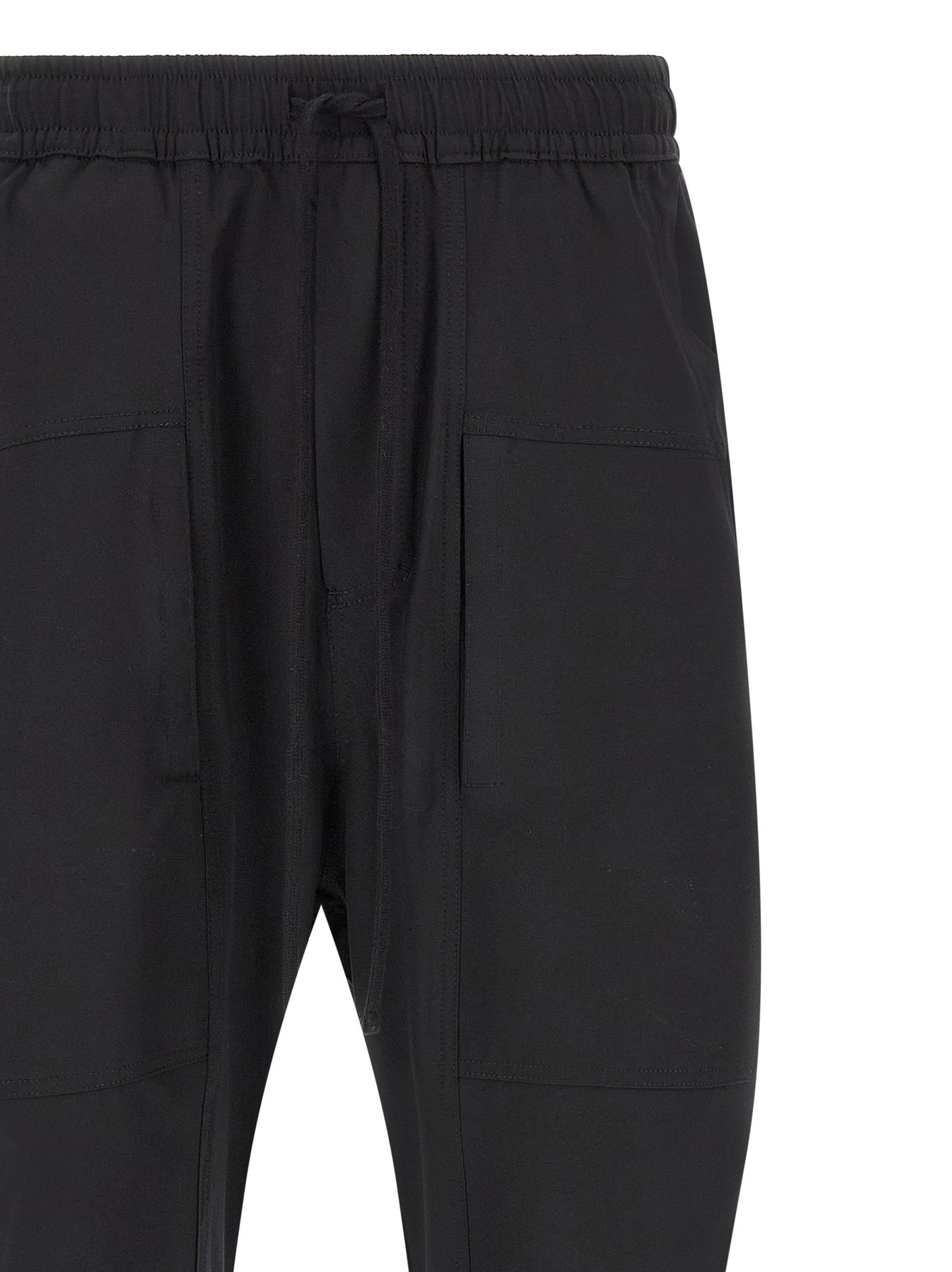 Trousers by Thom Krom for men in polyamide black features a artisanal silhouette, showcasing a sophisticated athletic & relaxed-fit with a long and for a artisanal finish.