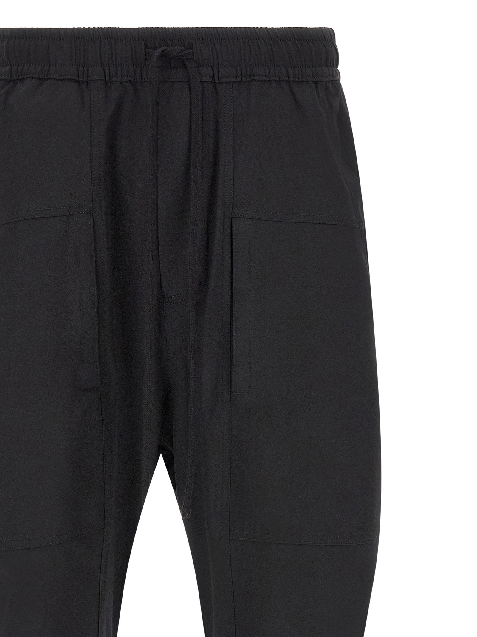 Trousers by Thom Krom for men in polyamide black features a artisanal silhouette, showcasing a sophisticated athletic & relaxed-fit with a long and for a artisanal finish.