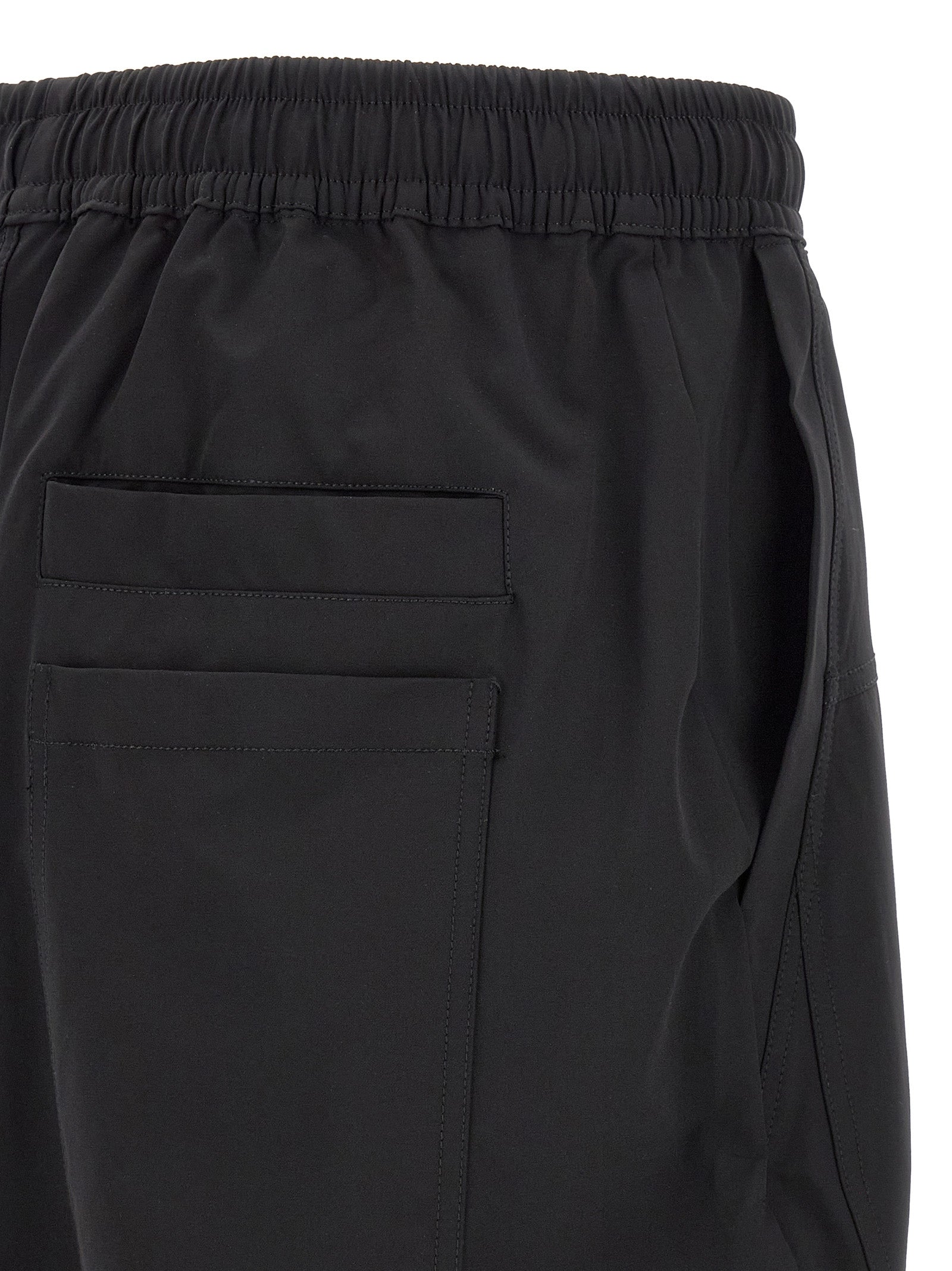 Trousers by Thom Krom for men in polyamide black presents a perennial silhouette, meticulously tailored with a athletic & relaxed-fit cut, long finish, and an elegant .