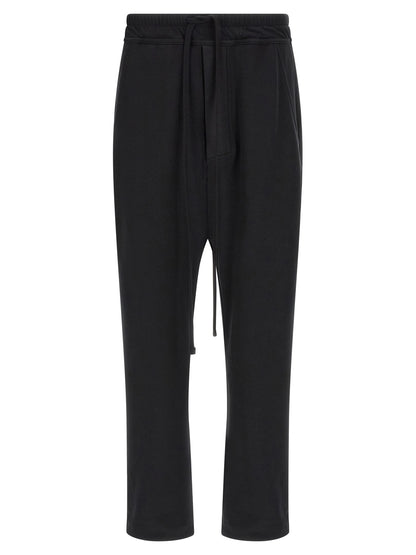 Trousers by Thom Krom for men in organic cotton black features an on trend silhouette, showcasing a sophisticated tapered-leg & relaxed-fit with a long and for an on trend finish.