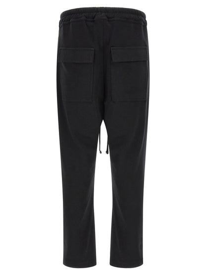 Trousers by Thom Krom for men in organic cotton black features an sartorial silhouette, showcasing a precise tapered-leg & relaxed-fit and long with a sartorial for a refined look.