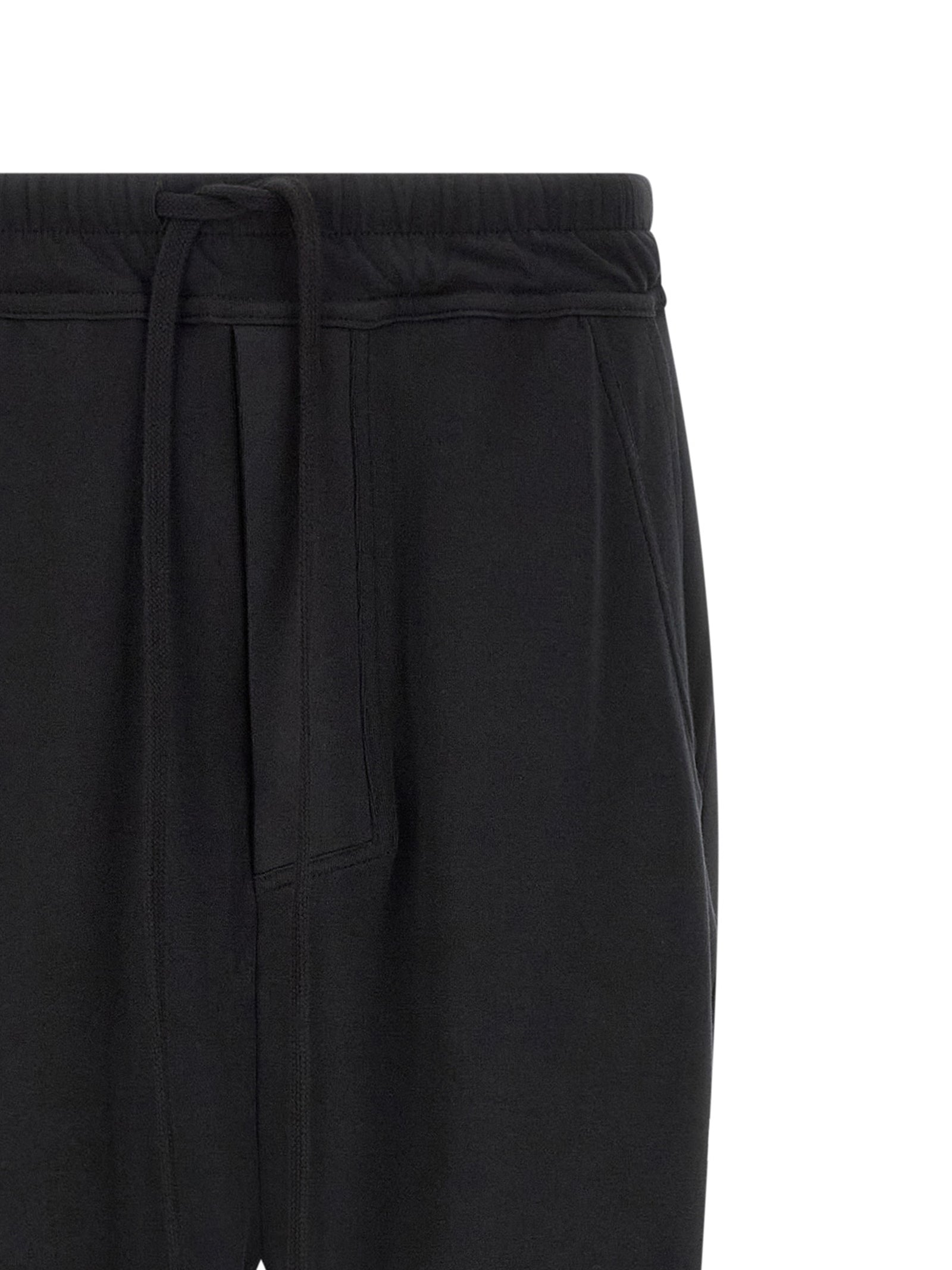 Trousers by Thom Krom for men in organic cotton black features an on trend silhouette, showcasing a sophisticated tapered-leg & relaxed-fit with a long and for an on trend finish.