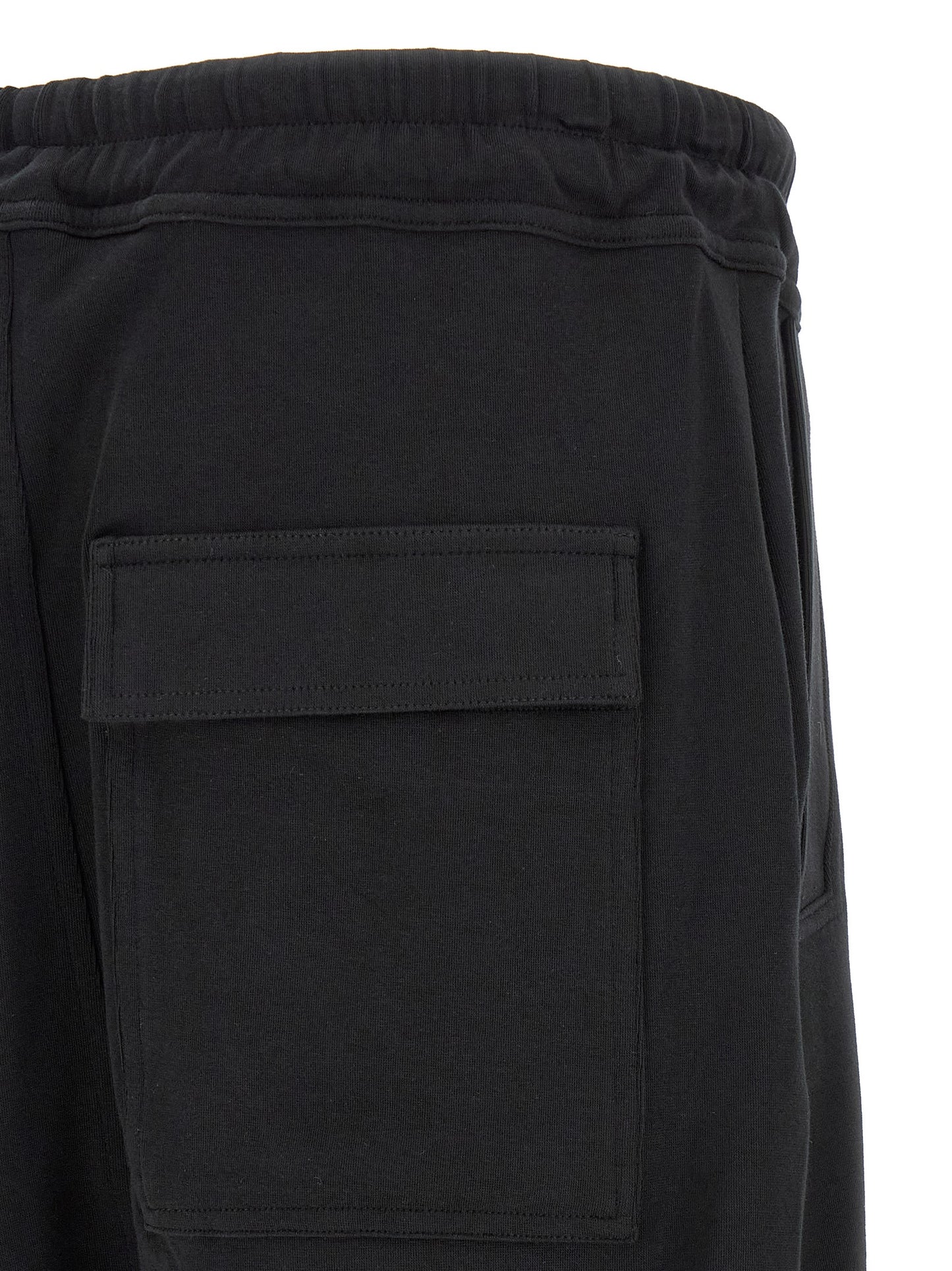 Trousers by Thom Krom for men in organic cotton black features a sculptural silhouette, showcasing a sculptural tapered-leg & relaxed-fit and long with a sophisticated for a sculptural finish.