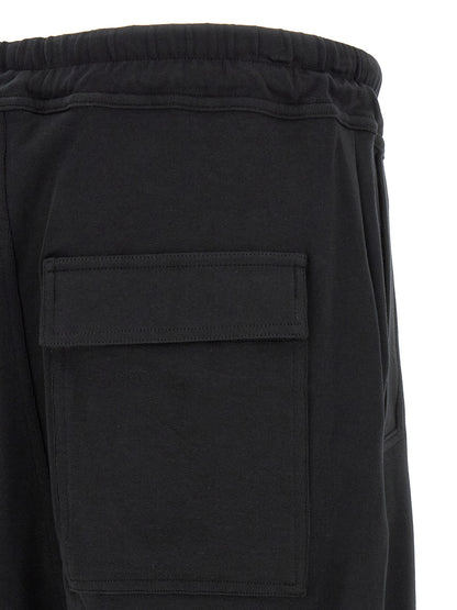 Trousers by Thom Krom for men in organic cotton black features a sculptural silhouette, showcasing a sculptural tapered-leg & relaxed-fit and long with a sophisticated for a sculptural finish.