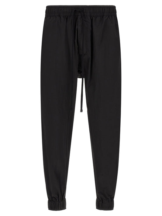 Trousers by Thom Krom for men in horse leather & polyamide black features an sartorial silhouette, showcasing a precise relaxed-fit and long with a sartorial for a refined look.